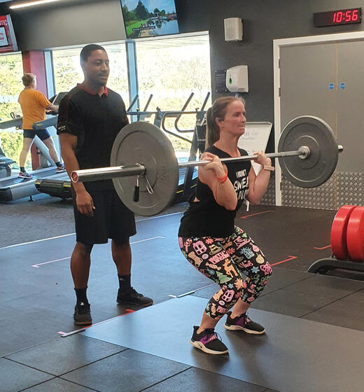 personal-trainer-client-gym-session Personal trainer coaching a client during a gym session in Derby
